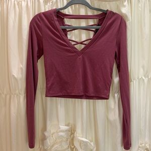 Forever 21 pink long sleeve crop top with cut out strappy back. Size SMALL.